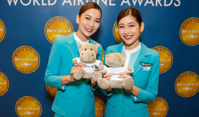 bangkok airways staff show off the 2022 awards goody bag hippo